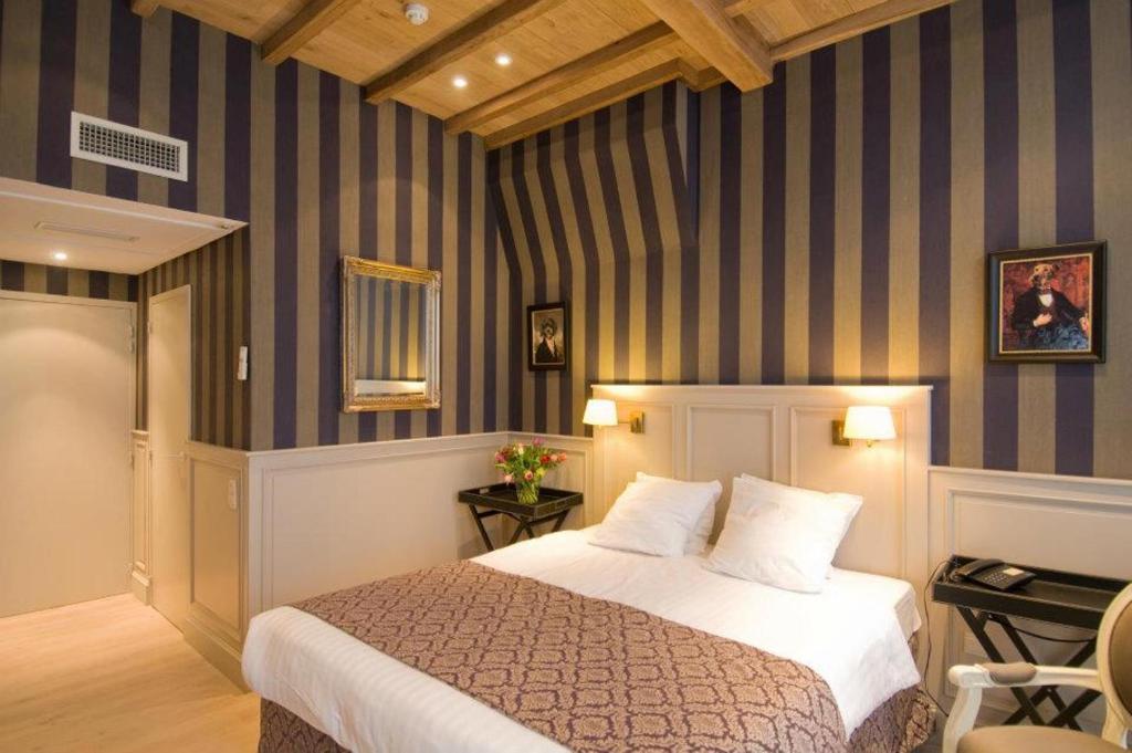 Postel nebo postele na pokoji v ubytování Hotel Patritius