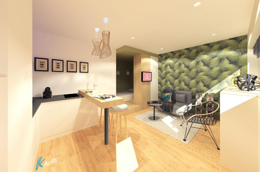 a kitchen and living room with a painting on the wall at Studio Design Paloma Dark in Lyon