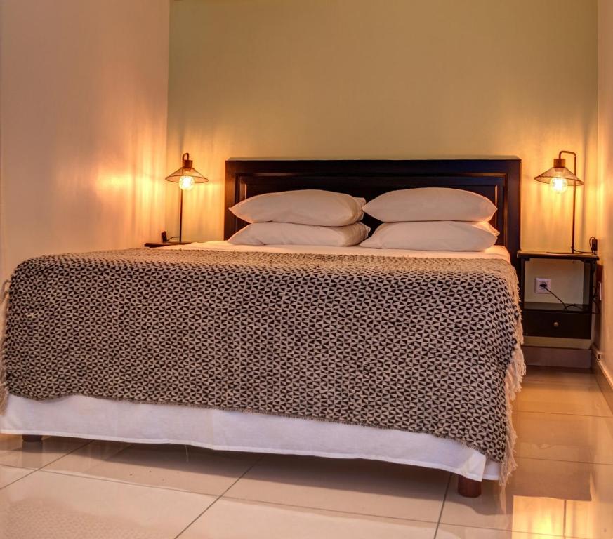 Postel nebo postele na pokoji v ubytování Hotel Pelican
