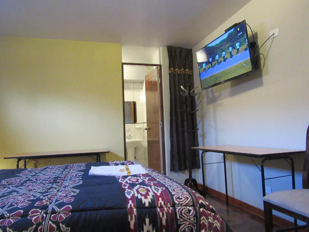 Postel nebo postele na pokoji v ubytování Hotel Sueños Dorados