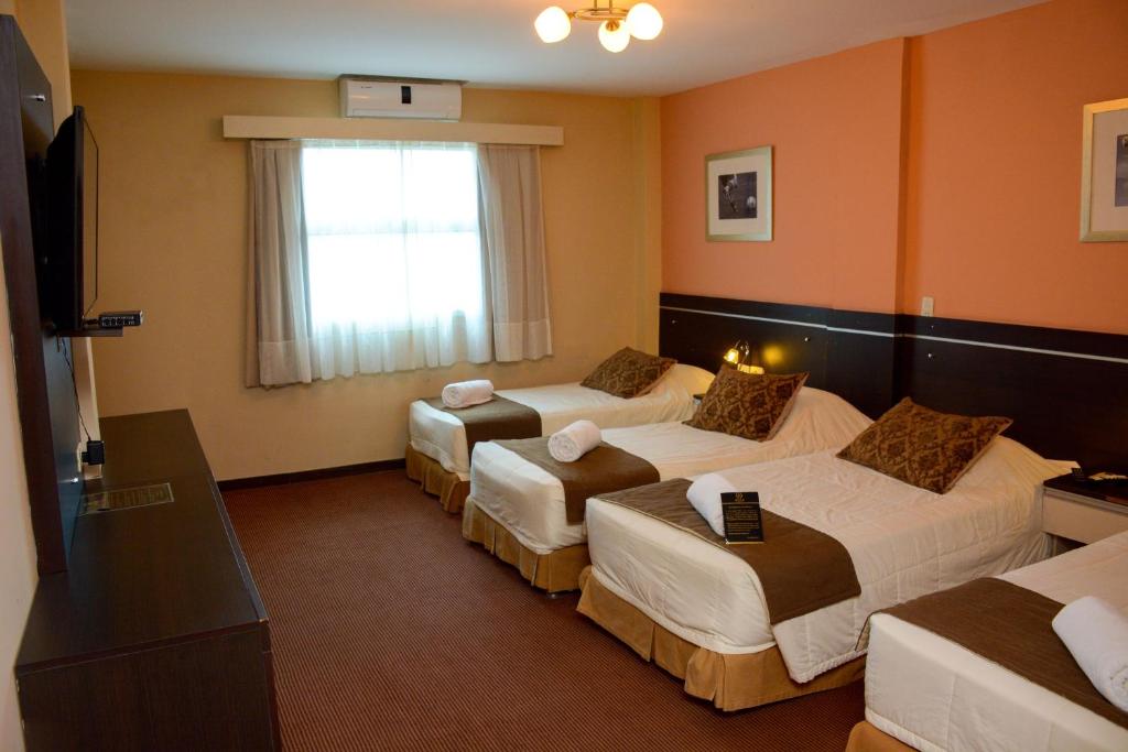 Postel nebo postele na pokoji v ubytování leclub resort hotel