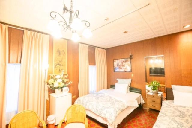 Postel nebo postele na pokoji v ubytování Shirahama Hotel