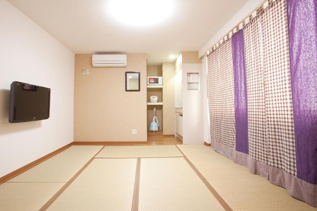 TV a/nebo společenská místnost v ubytování Hanabi Hotel