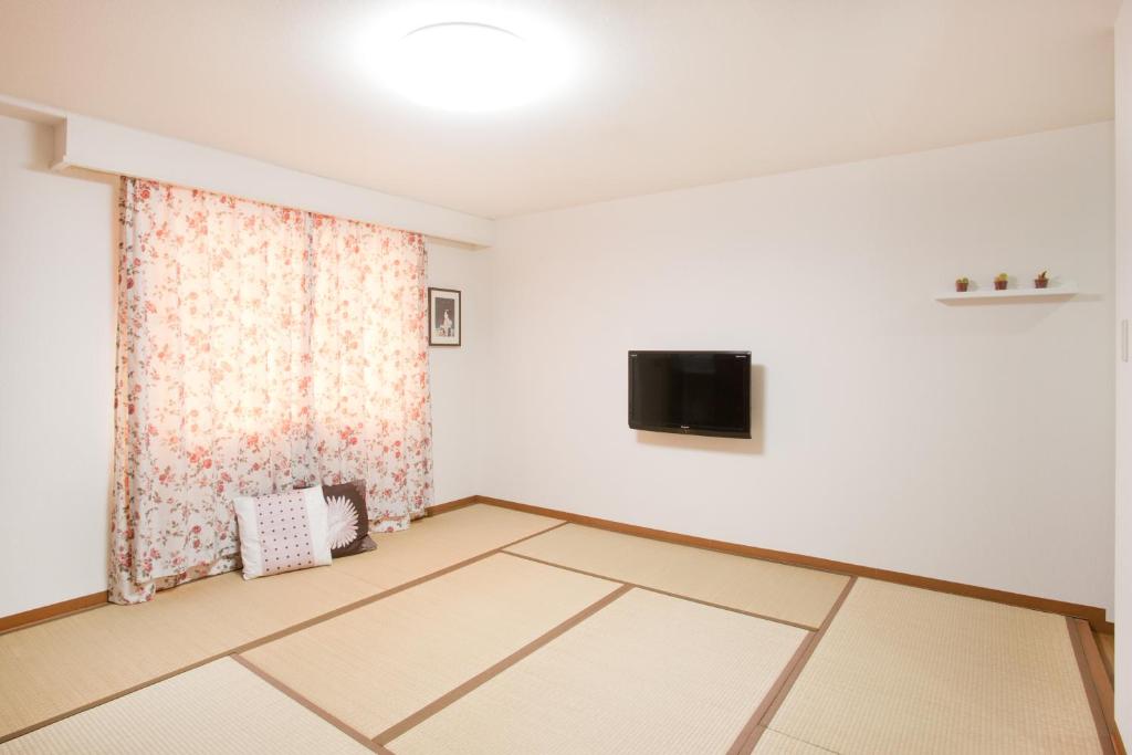 TV a/nebo společenská místnost v ubytování Hanabi Hotel