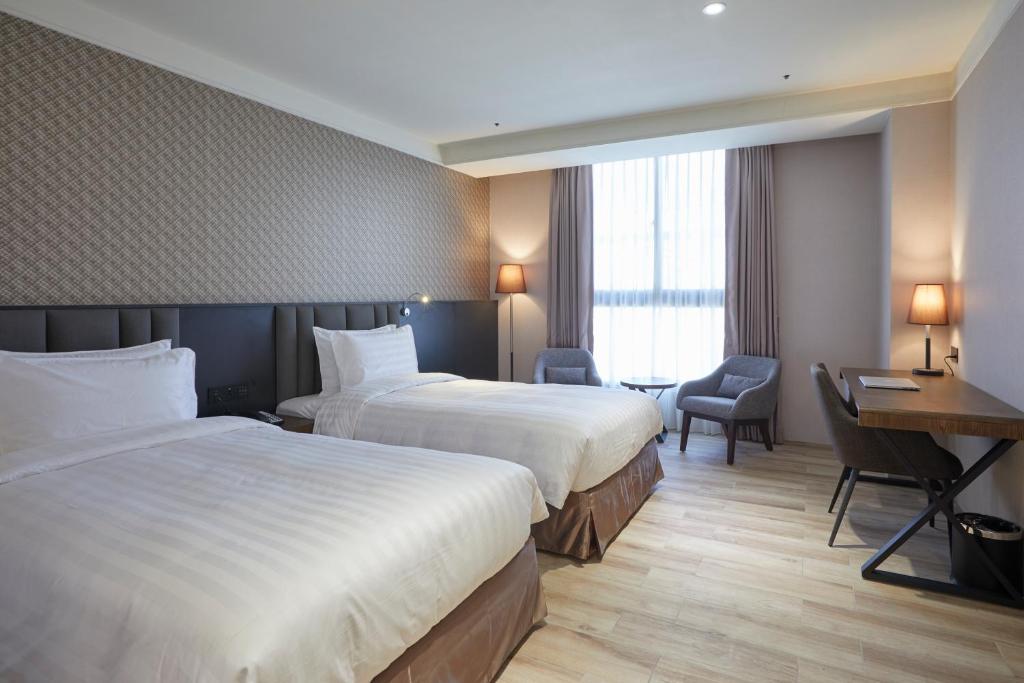 Postel nebo postele na pokoji v ubytování Lai Hotel