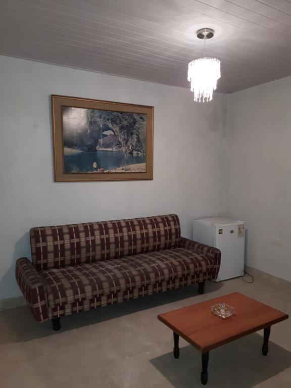 a living room with a couch and a table at Tu Casa in Asunción