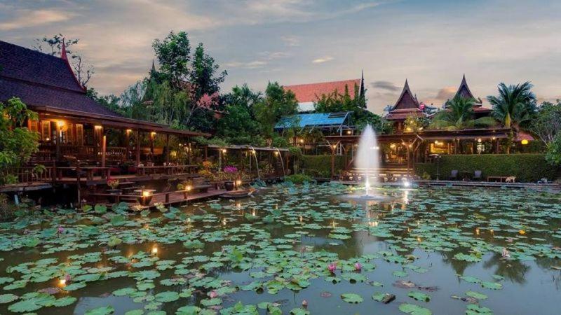 a large pool of water in front of a large building at Ayutthaya retreat in Phra Nakhon Si Ayutthaya