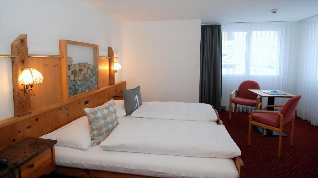 Postel nebo postele na pokoji v ubytování Hotel Crystal
