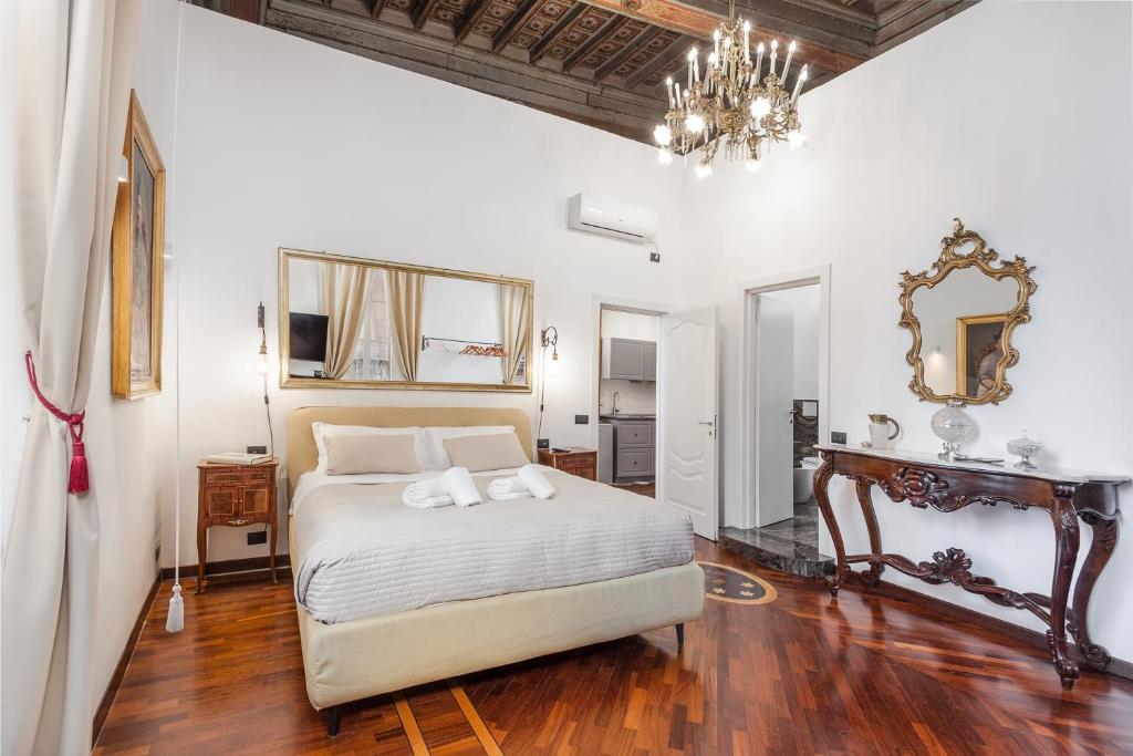 A bed or beds in a room at Palazzo Del Duca Piazza Navona Guest House