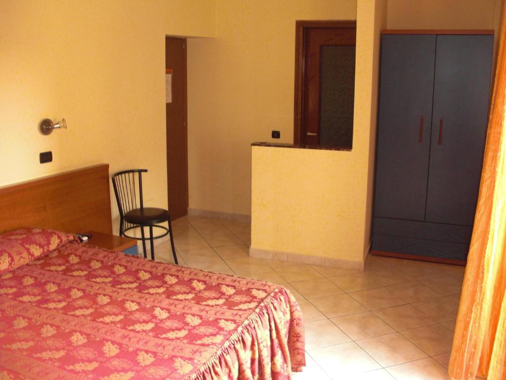 Postel nebo postele na pokoji v ubytování Hotel Legnano
