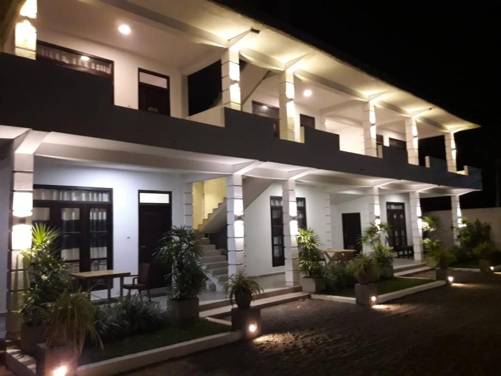 a night view of a building with lights at Airport Grand Holiday Home in Katunayake