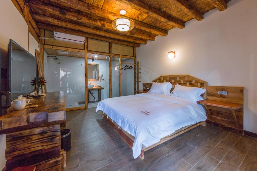 Postel nebo postele na pokoji v ubytování Swallow Nest Guesthouse