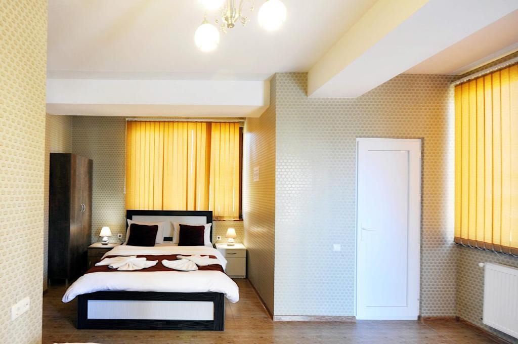 Postel nebo postele na pokoji v ubytování Hotel Kavela