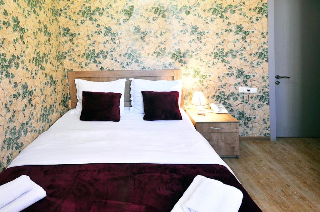 Postel nebo postele na pokoji v ubytování Hotel Kavela