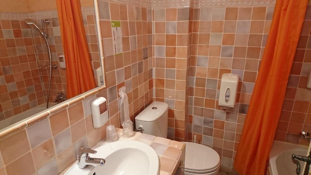 Koupelna v ubytování Hotel Les Cavalets