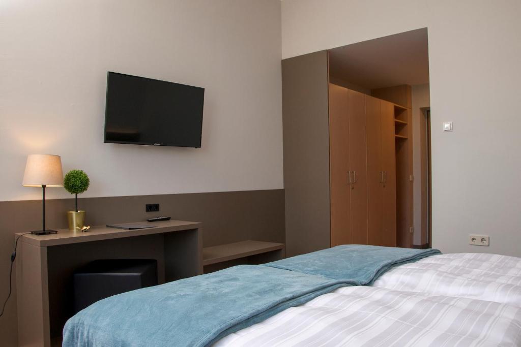 Postel nebo postele na pokoji v ubytování campus Horn