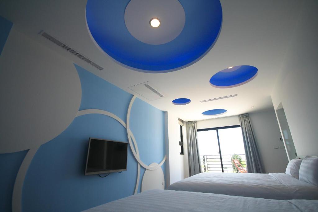Postel nebo postele na pokoji v ubytování Colorful Homestay