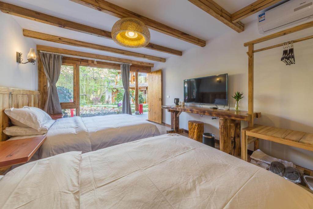Postel nebo postele na pokoji v ubytování Swallow Nest Guesthouse