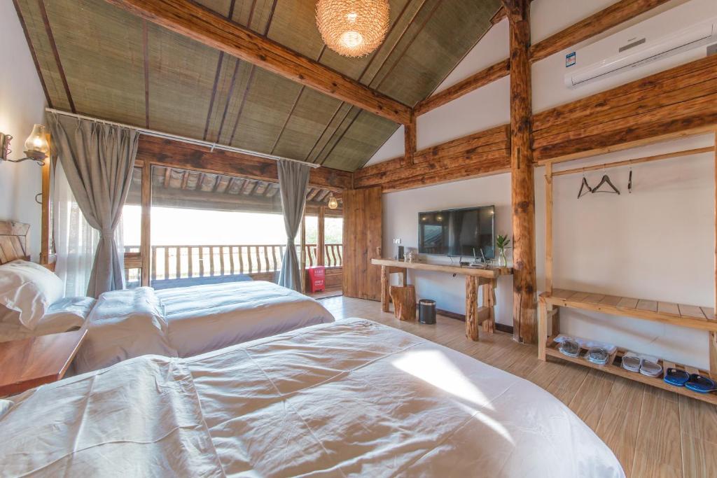 Postel nebo postele na pokoji v ubytování Swallow Nest Guesthouse