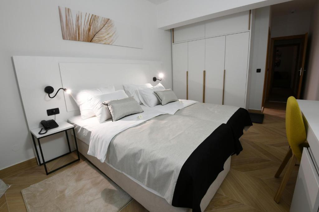 Postel nebo postele na pokoji v ubytování Aparthotel Milenij