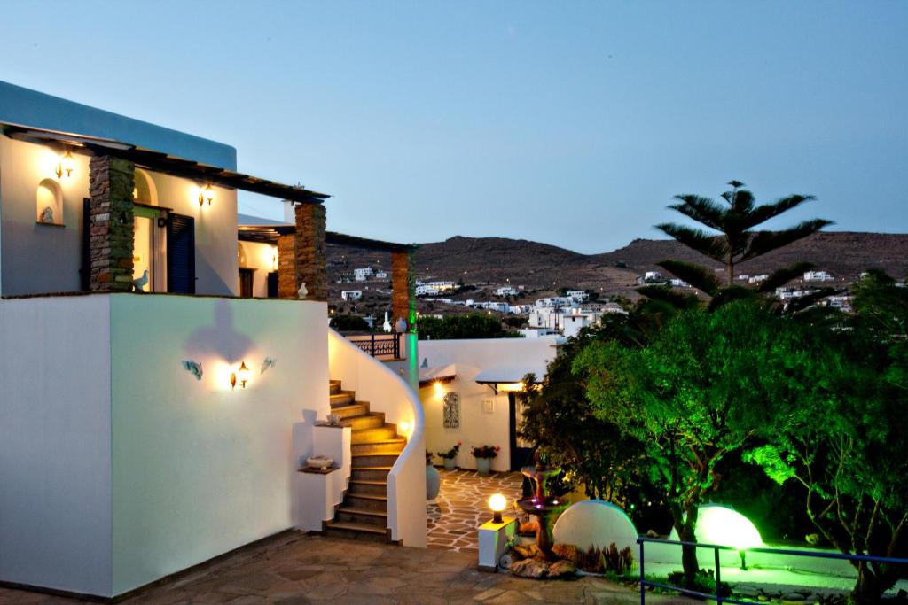 a view of a house at night with lights at Irini Studios in Tinos in Agios Ioannis Tinos