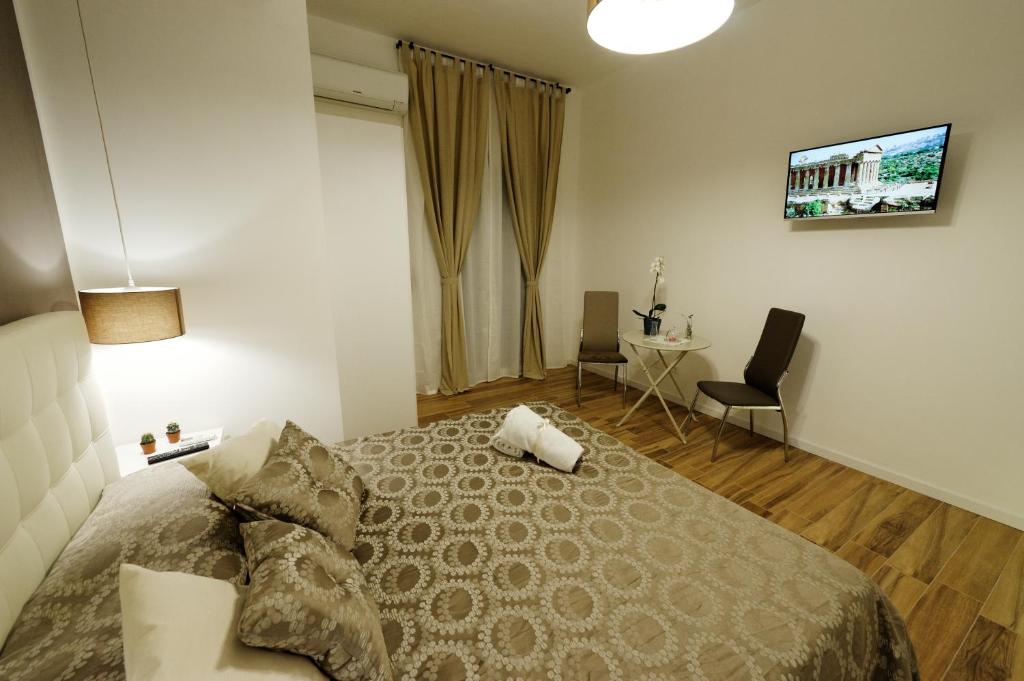Postel nebo postele na pokoji v ubytování Gocce di Girgenti - comfort suites