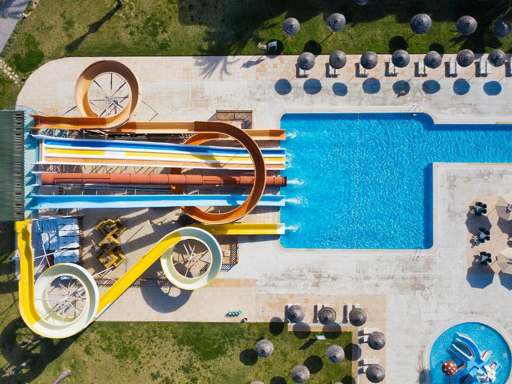 an overhead view of a swimming pool with a pool at AQI Skanes Resort in Monastir