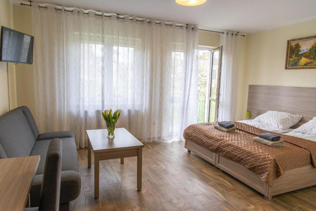 Postel nebo postele na pokoji v ubytování Apartamenty Ewa II