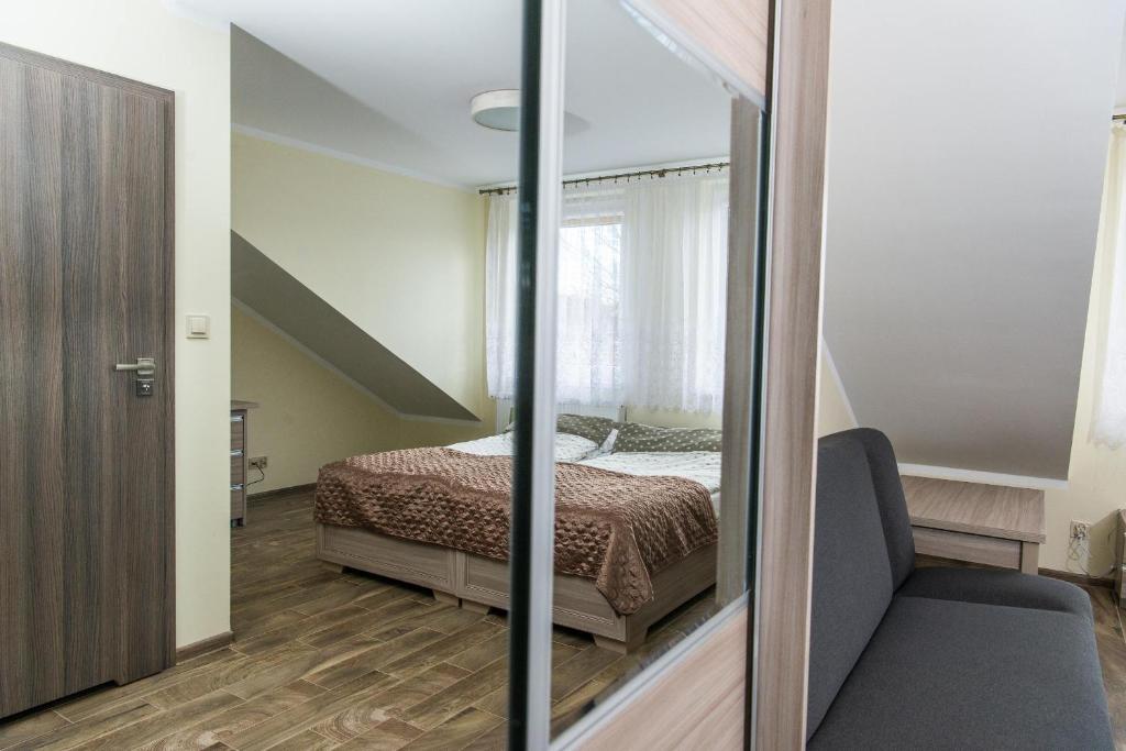 Postel nebo postele na pokoji v ubytování Apartamenty Ewa II