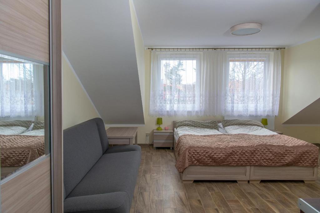 Postel nebo postele na pokoji v ubytování Apartamenty Ewa II