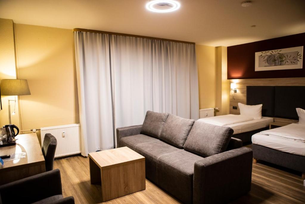 Postel nebo postele na pokoji v ubytování BlnCty Hotel