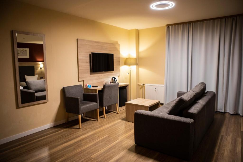 TV a/nebo společenská místnost v ubytování BlnCty Hotel