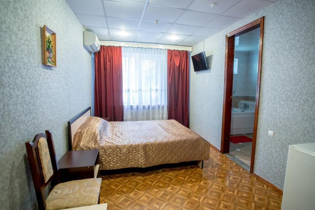 Postel nebo postele na pokoji v ubytování Premium Hotel