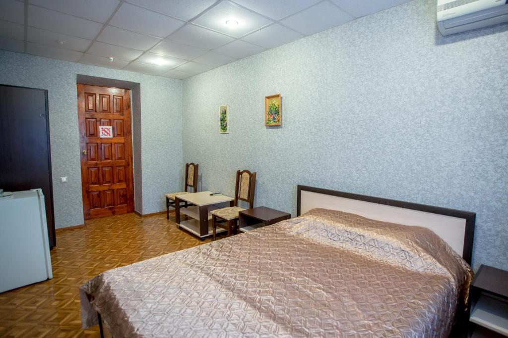 Postel nebo postele na pokoji v ubytování Premium Hotel