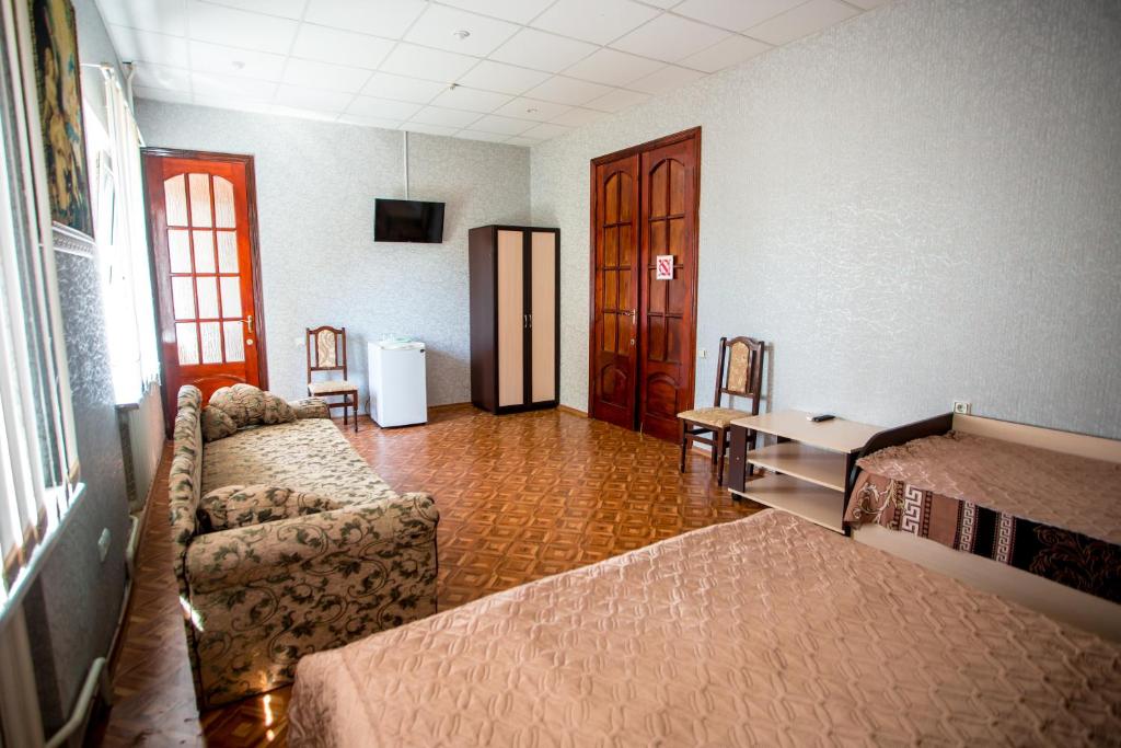 Postel nebo postele na pokoji v ubytování Premium Hotel