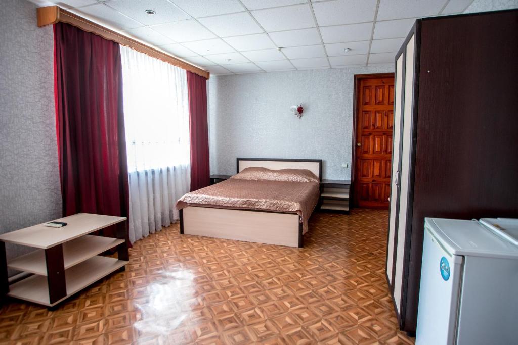Postel nebo postele na pokoji v ubytování Premium Hotel