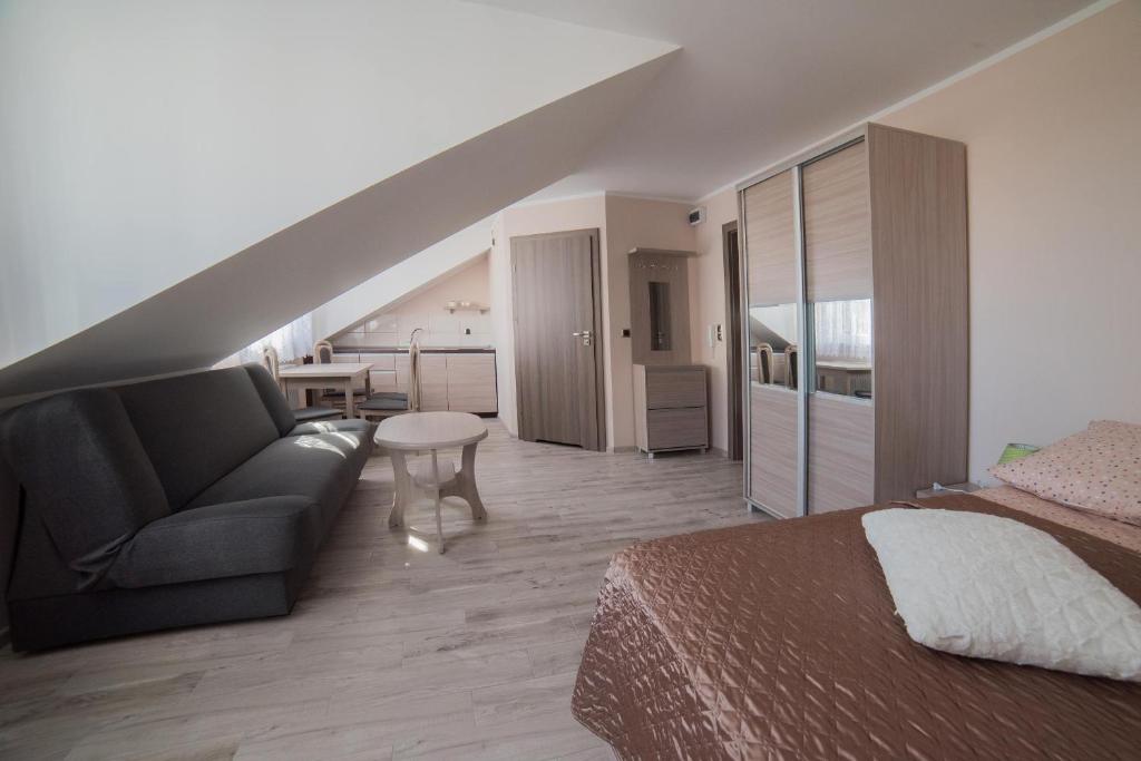 Postel nebo postele na pokoji v ubytování Apartamenty Ewa II