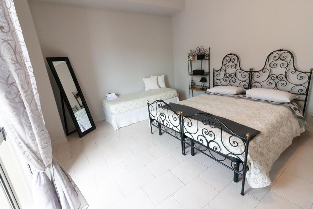 Postel nebo postele na pokoji v ubytování Sottovento B&B
