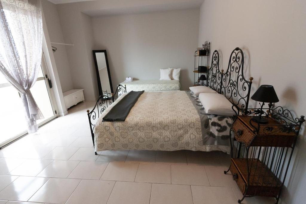 Postel nebo postele na pokoji v ubytování Sottovento B&B