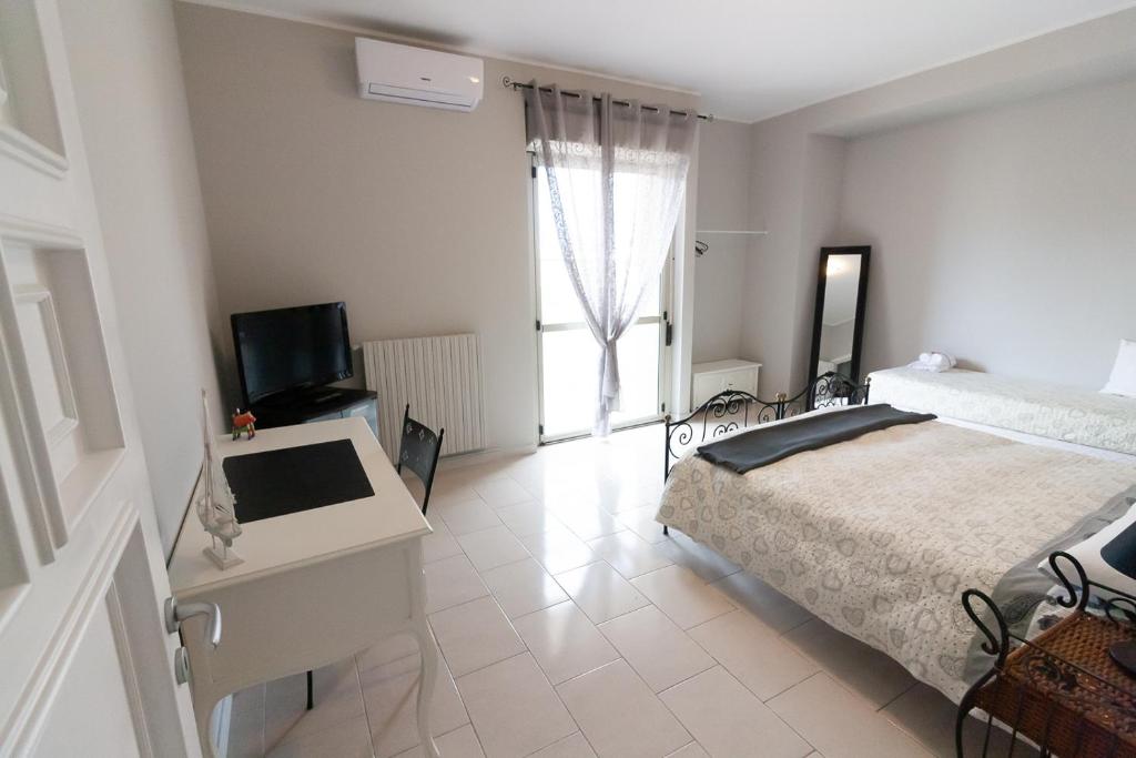 Postel nebo postele na pokoji v ubytování Sottovento B&B