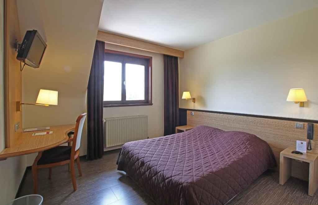 Postel nebo postele na pokoji v ubytování Sud Hotel