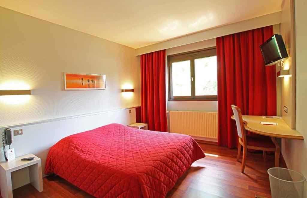Postel nebo postele na pokoji v ubytování Sud Hotel