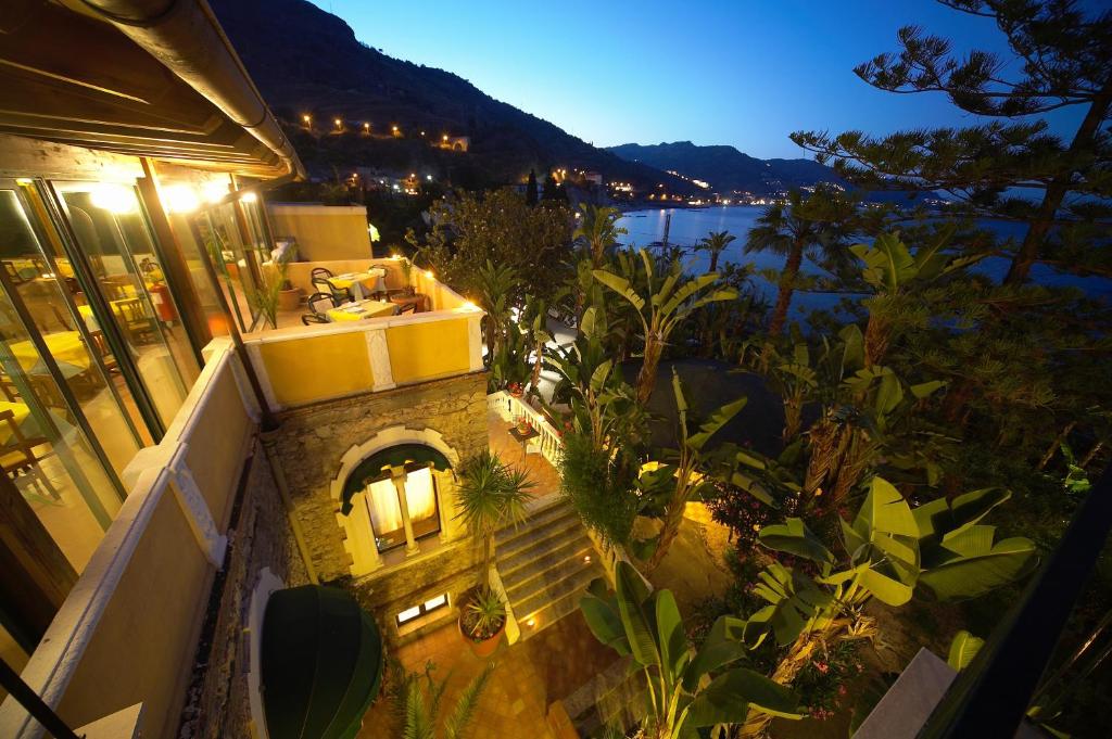 an overhead view of a building with a view of the water at Hotel Baia Delle Sirene in Taormina