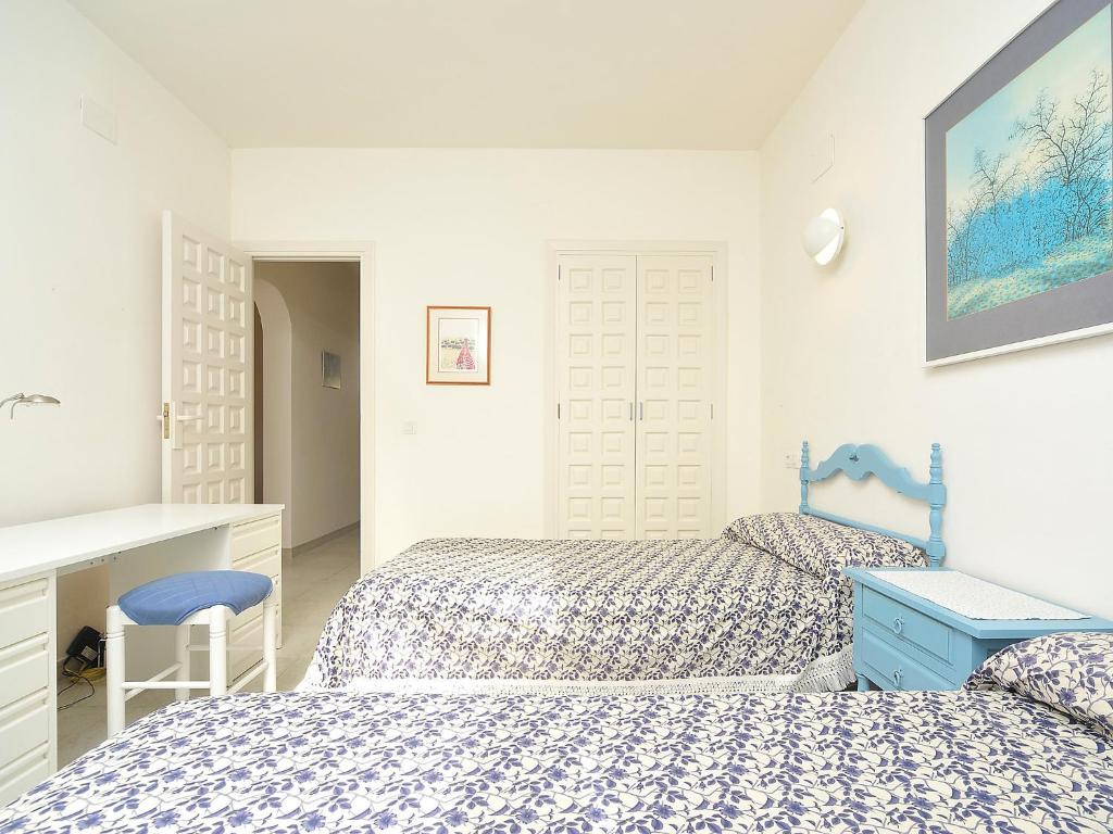 A bed or beds in a room at Villa Vista Panorama by Interhome