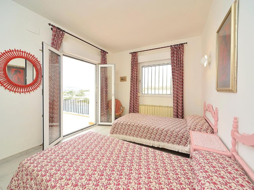A bed or beds in a room at Villa Vista Panorama by Interhome