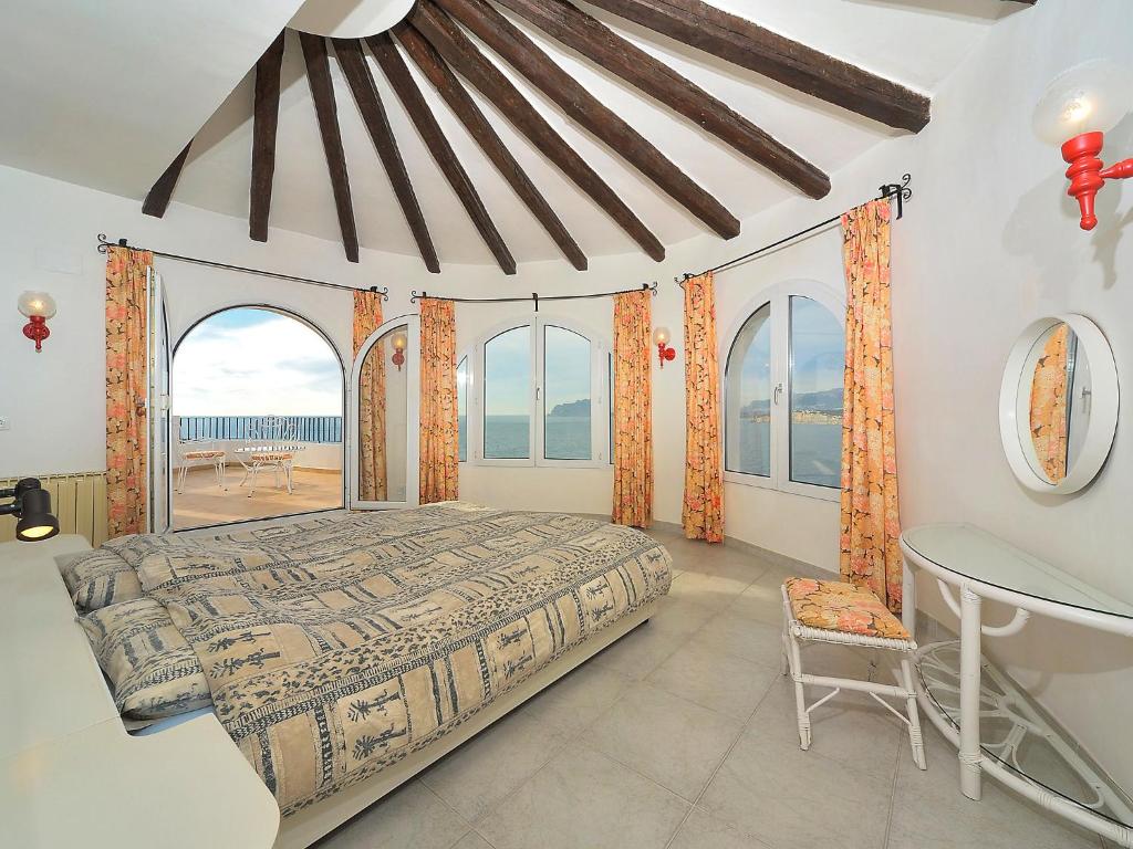A bed or beds in a room at Villa Vista Panorama by Interhome
