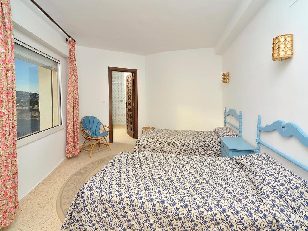 A bed or beds in a room at Villa Vista Panorama by Interhome