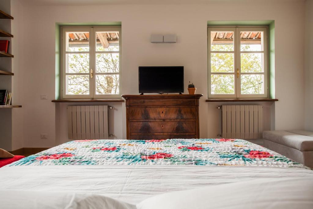 Łóżko lub łóżka w pokoju w obiekcie AMERICA NEI BOSCHI B&B