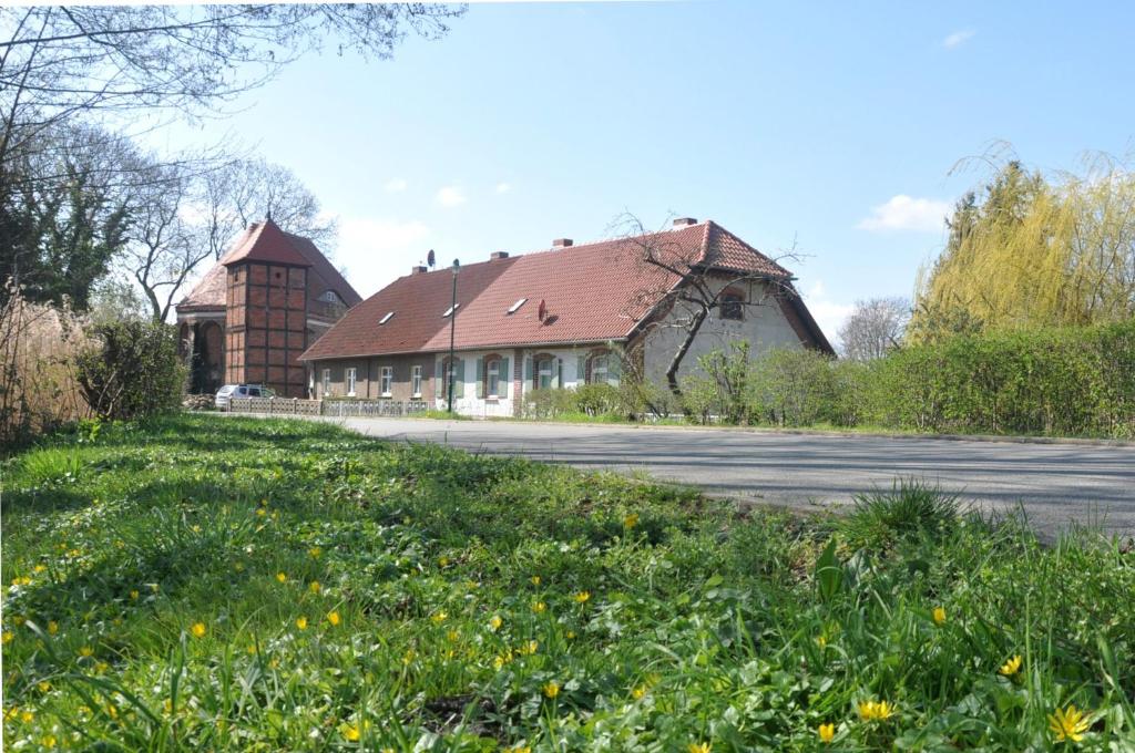 an old house with a red roof on a street at Ferienhaus Ilse-Bilse in Neuhausen