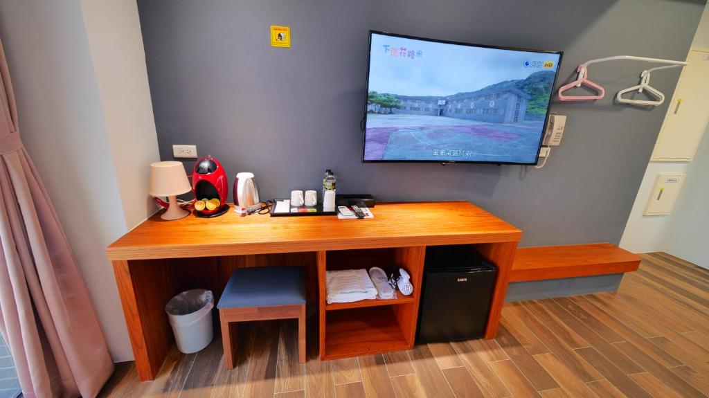 TV a/nebo společenská místnost v ubytování Apause Hotel